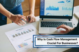 Two people analysing sales reports and financial charts, emphasising the importance of cash flow management for businesses.