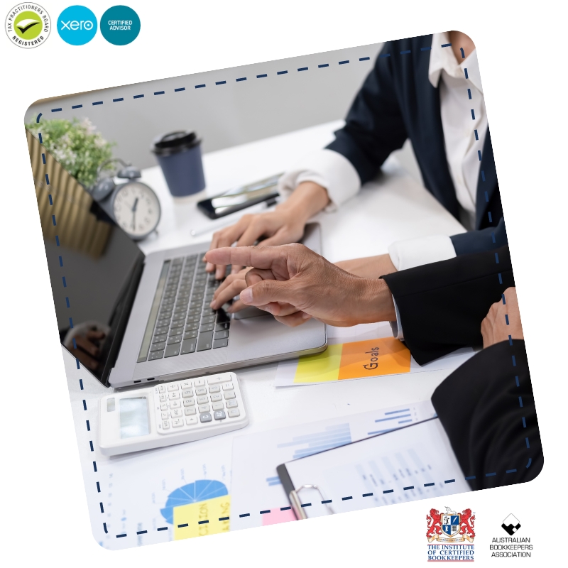 Professional Accounts Administrator guiding a colleague on financial reports, using a laptop, calculator, and charts in the office.